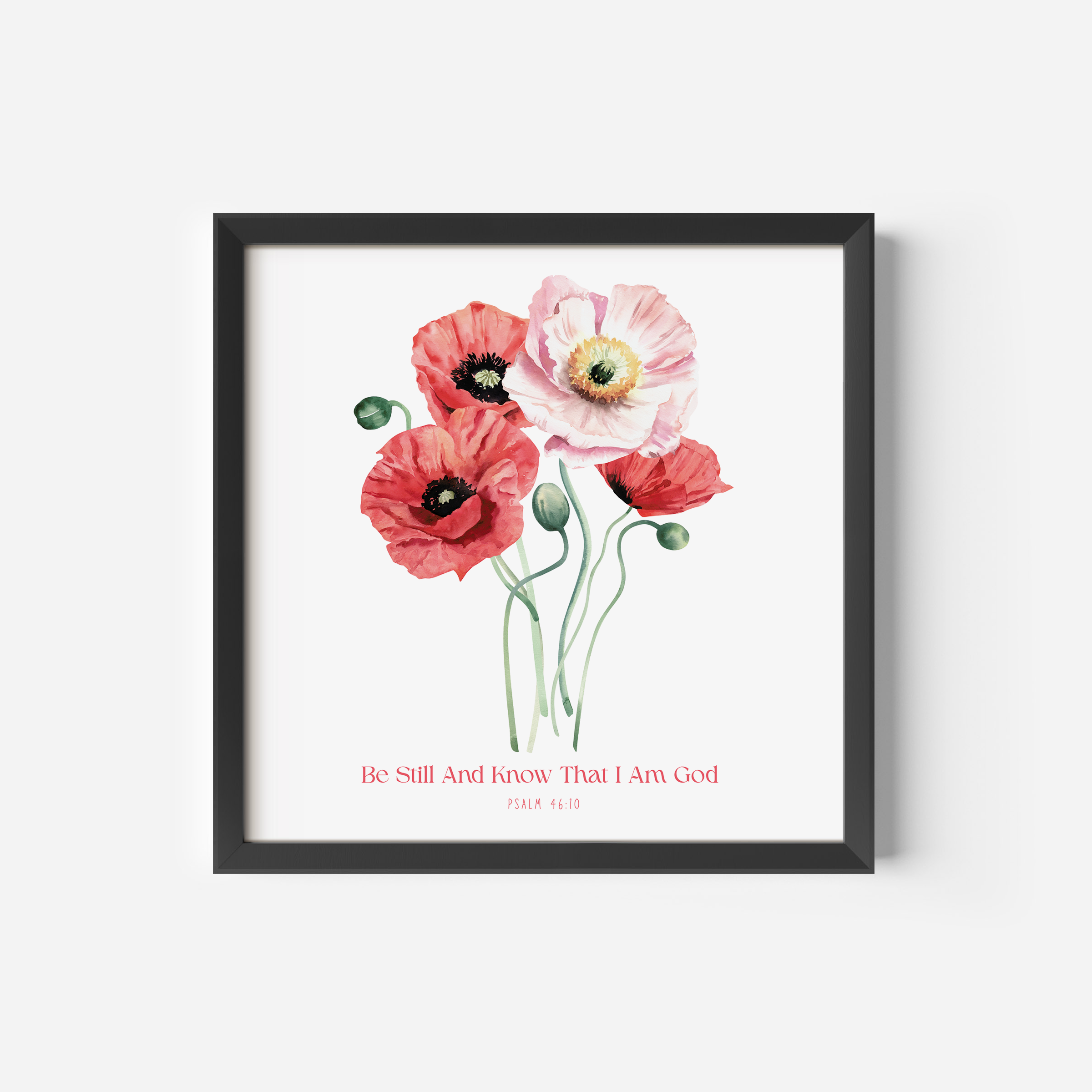 Framed wall art featuring a watercolor-style floral arrangement with red and pale pink poppies on a white background, with the text 'Be Still And Know That I Am God' and 'PSALM 46:10' below. 