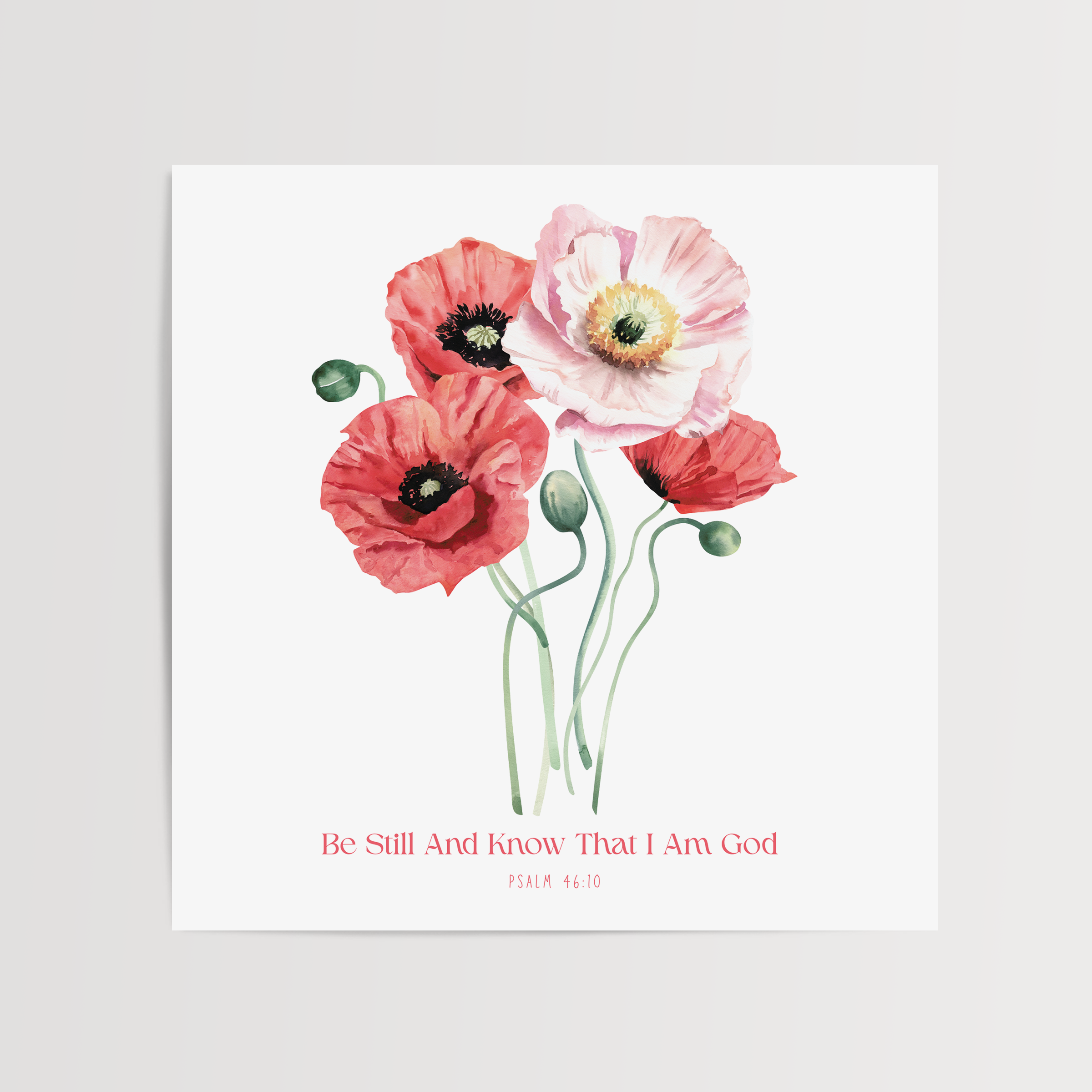 A square art print featuring a watercolor illustration of four poppies in shades of red, pink, and white with green stems, displayed on a light gray background. Below the flowers, the text reads 'Be Still And Know That I Am God' in a small red font.