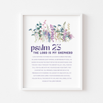 A framed wall art print featuring a watercolor illustration of purple, pink, and blue wildflowers above the text 'psalm 23 THE LORD IS MY SHEPHERD' 